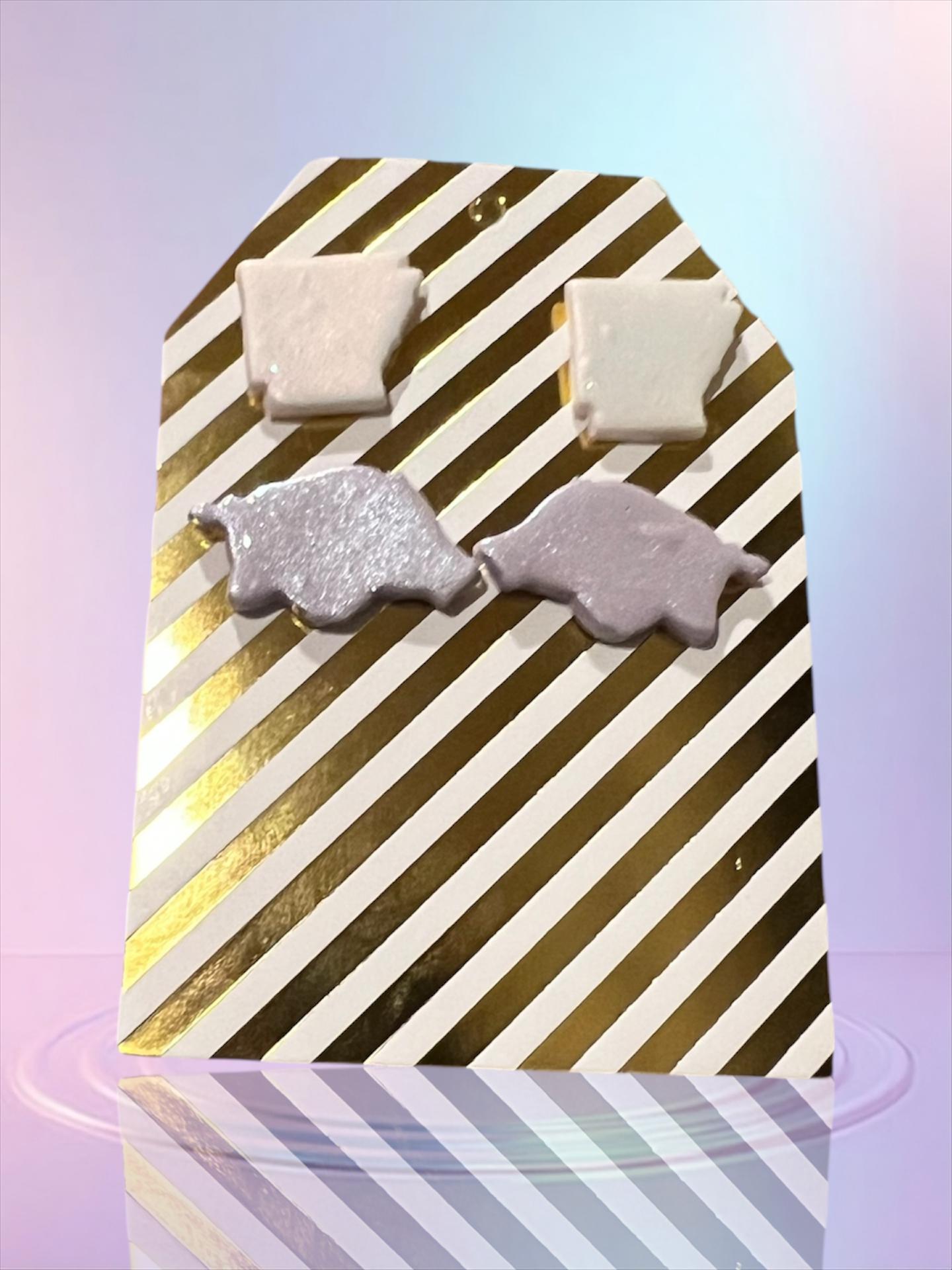 Shimmery State studs and Lilac Razorback studs